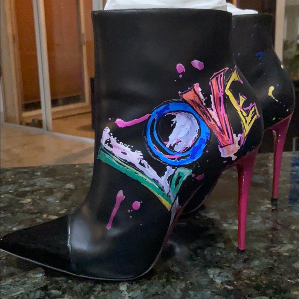 Christian Louboutin “love” boots